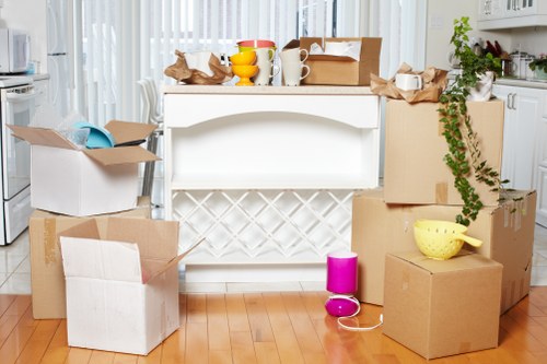 Experienced movers in Lambeth preparing furniture for transport