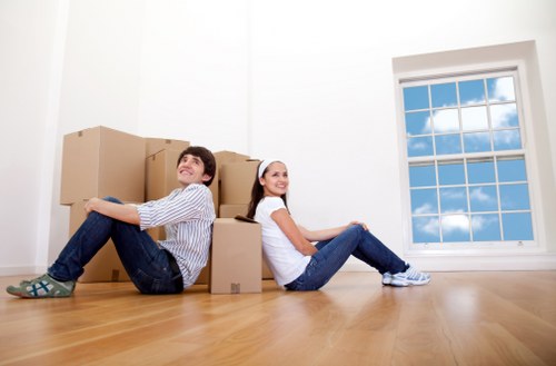 Packed office equipment and moving supplies for a business relocation