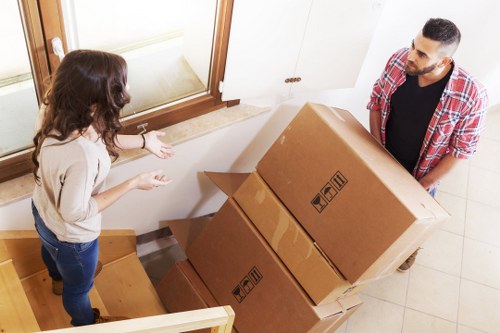 Moving team unloading items at a property