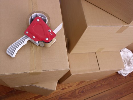 Moving furniture carefully through a Lambeth property access route